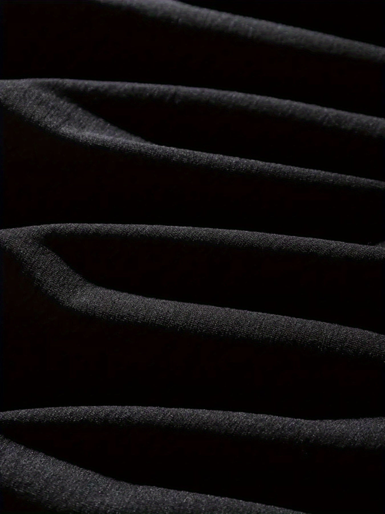 Close-up of black fabric with folds